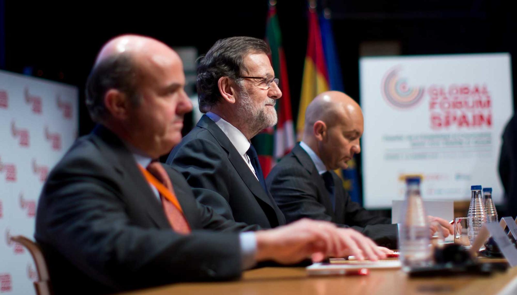 Guindos y Rajoy.